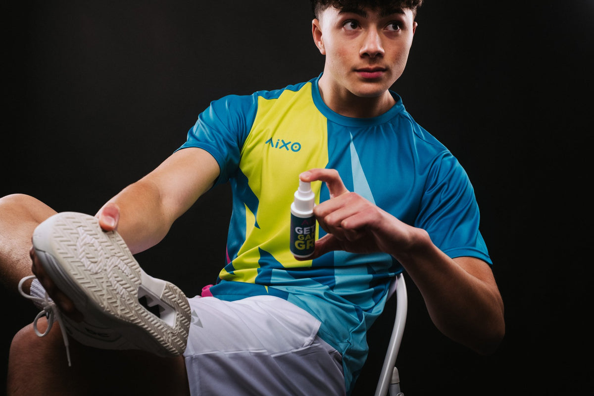 Player holding an AIXO carbon pickleball paddle