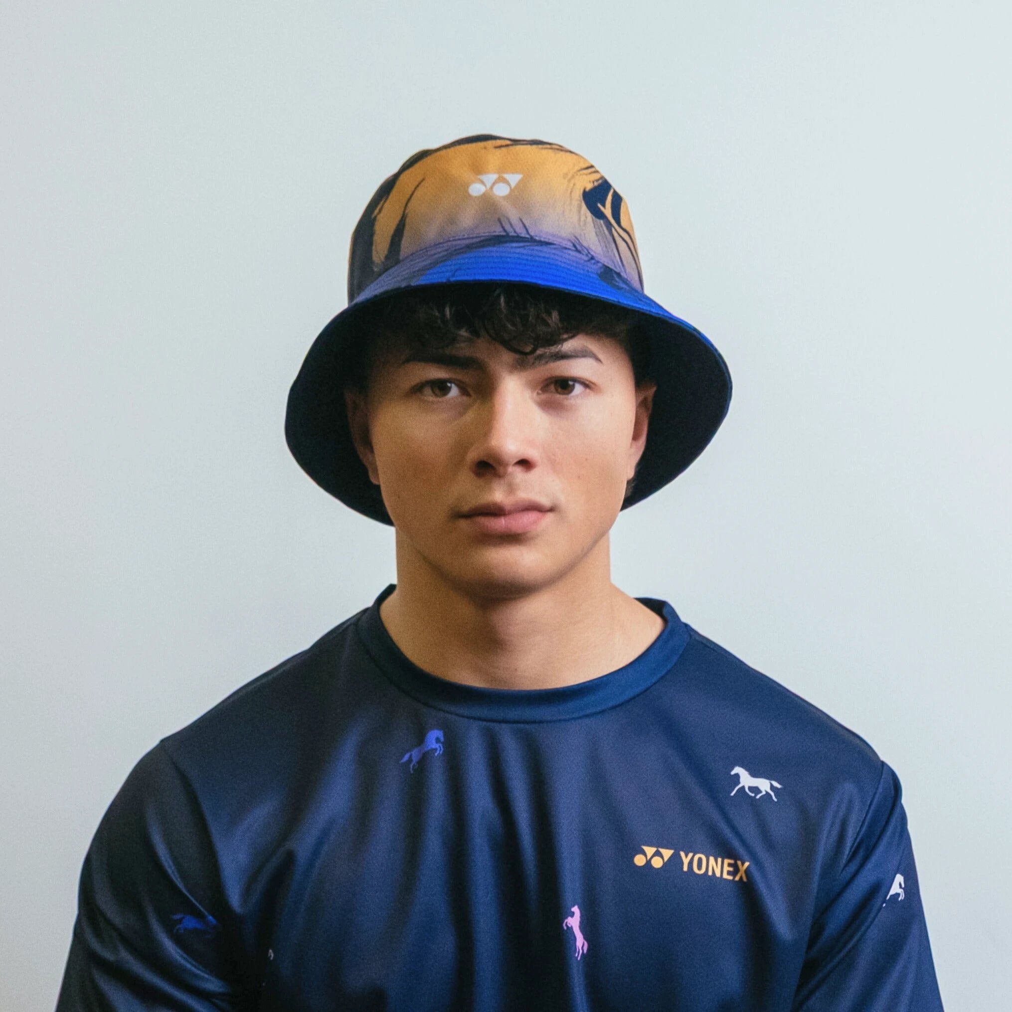 Yonex Legend’s Crown – Reversible Bucket Hat (Ink Blue | Celestial Purple / Pale Gold) Yonex CNY2026 Reversible Bucket Hat A Unisex Clothing Yonex