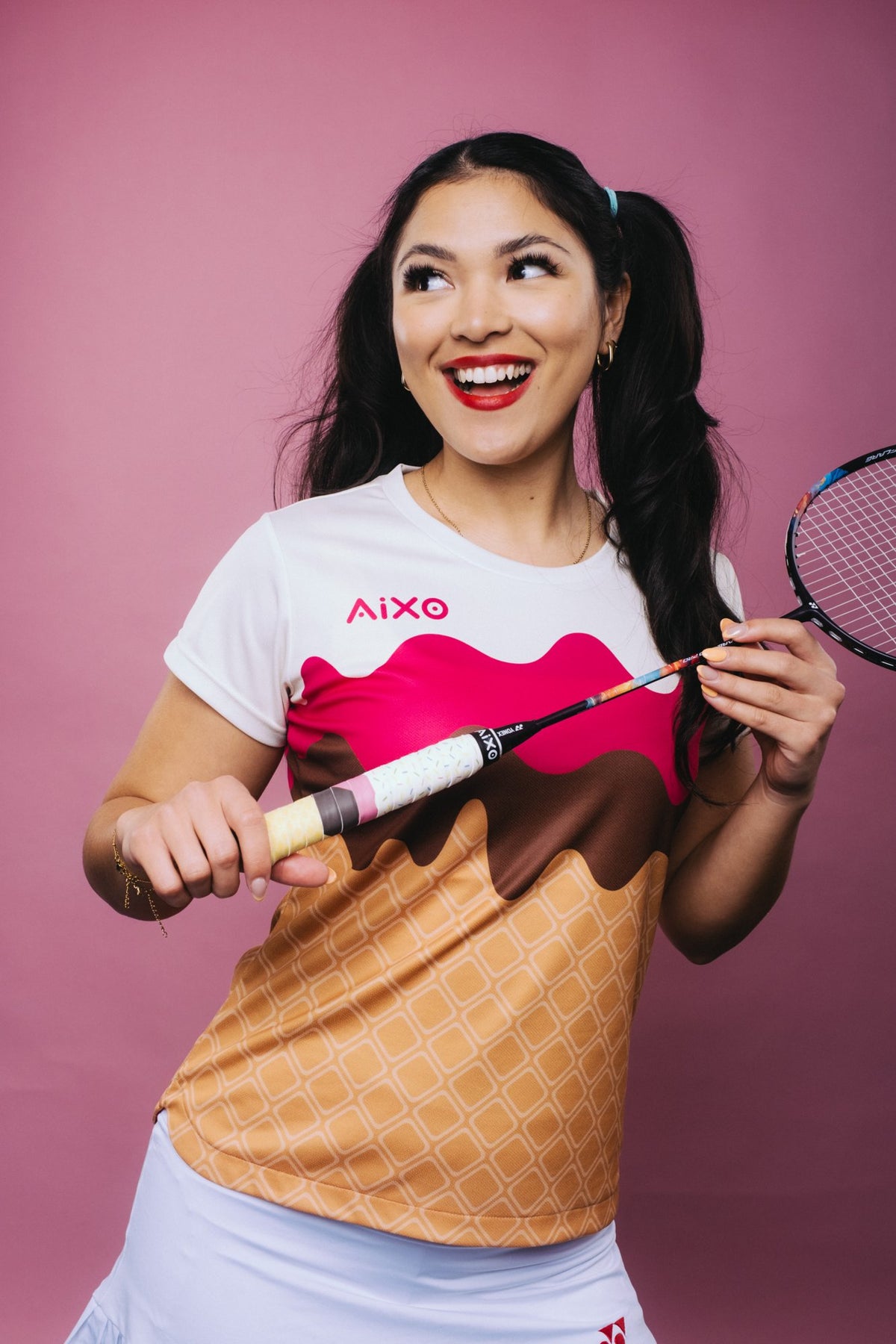 Player with AIXO pickleball paddle and colour clash kit